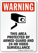 This Area Protected by Armed Guard Sign